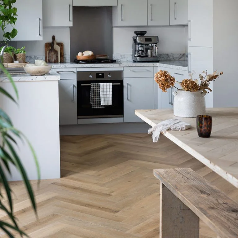 Herringbone luxury vinyl plank in a bright kitchen