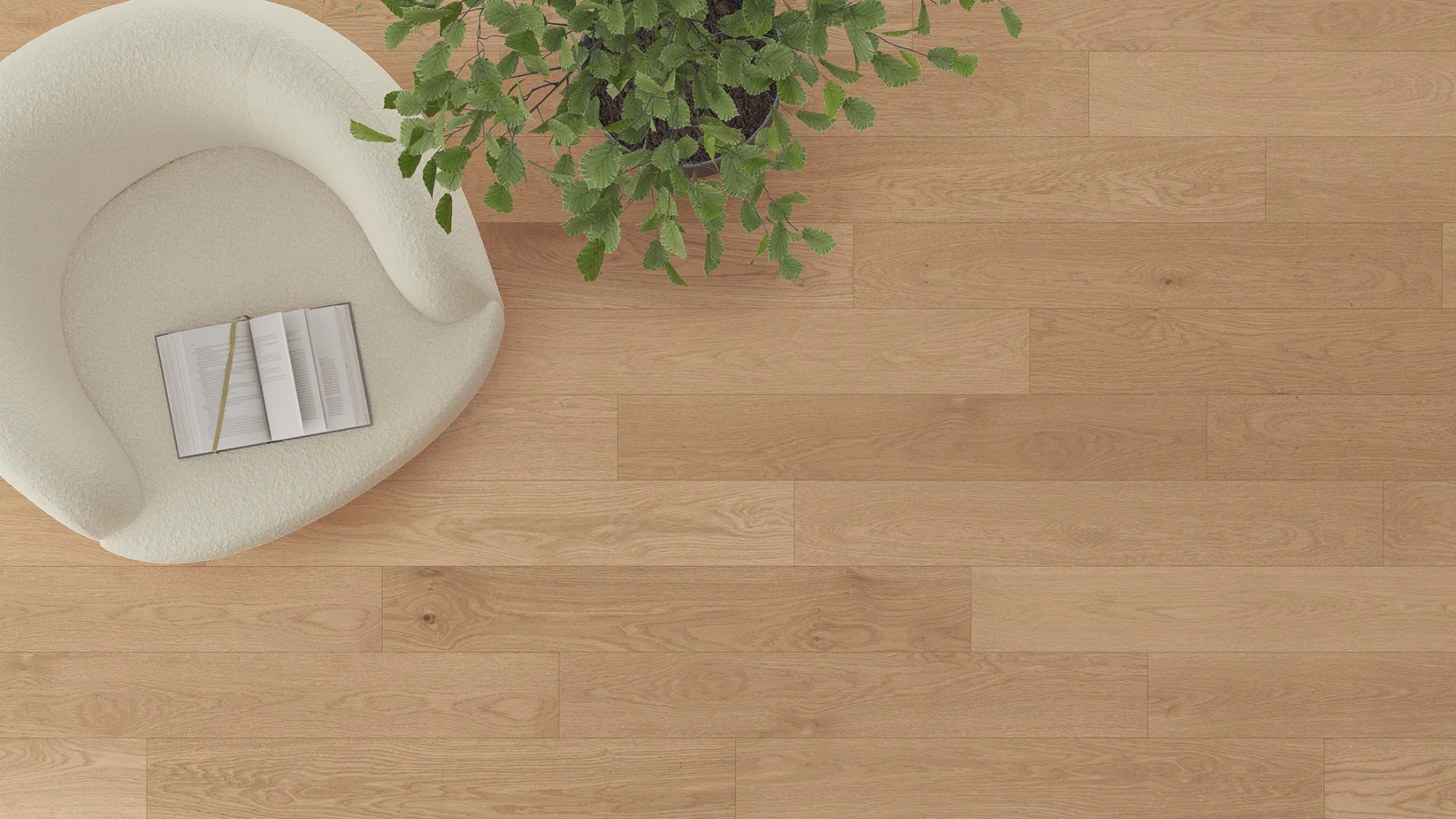 Overhead view of a warm oak luxury vinyl plank floor with a lounge chair and plant