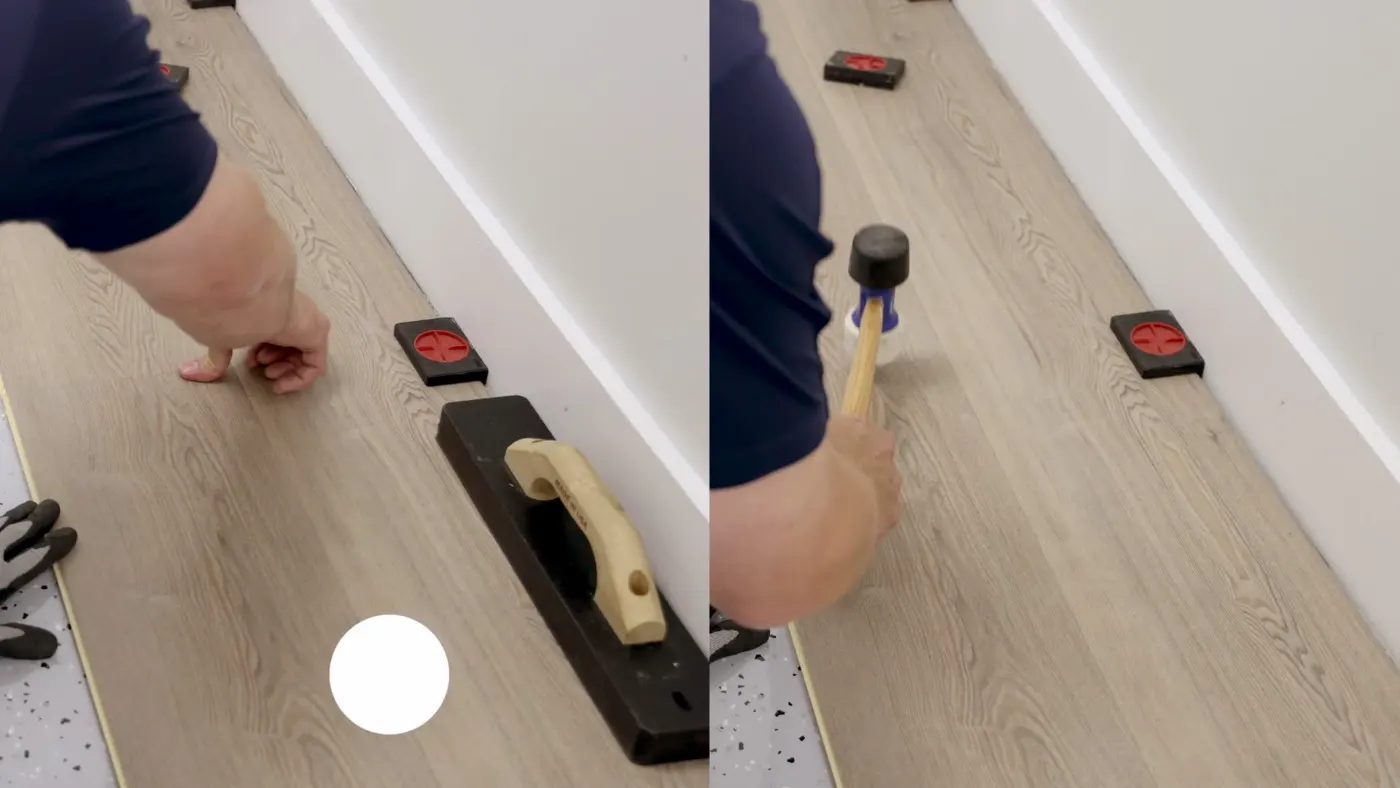 Luxury vinyl plank being laid row by row across a room